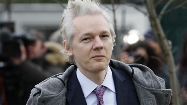 Who is Julian Assange's father?